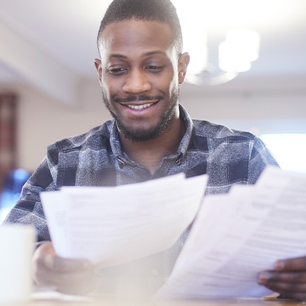 A man reads a financial award letter