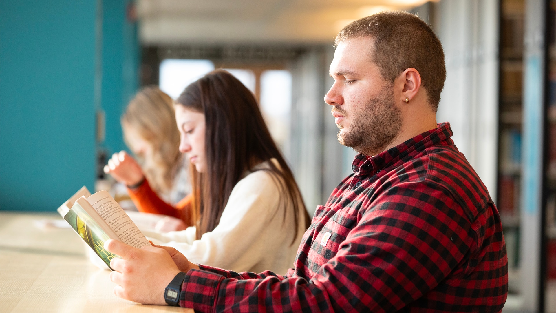 Students reading books.