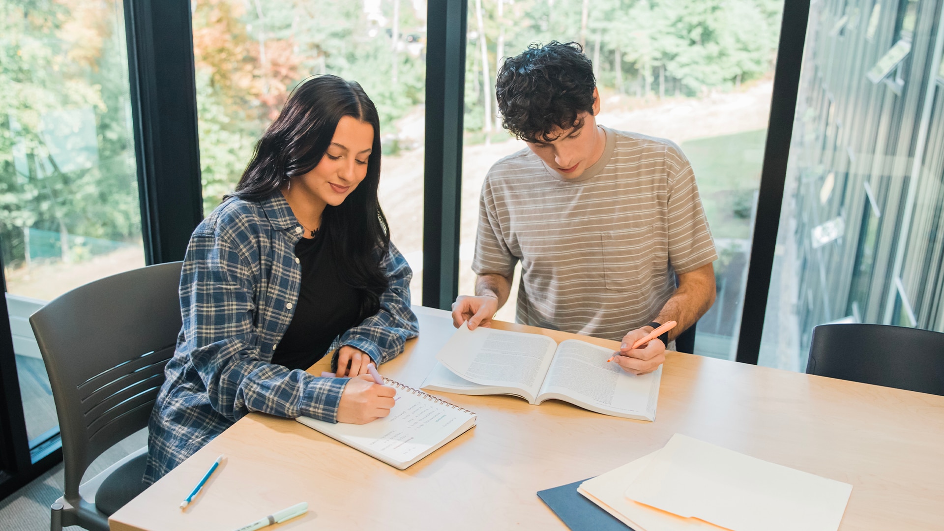 A group of two students studying together.