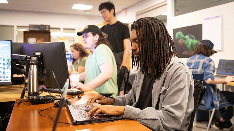 Students working in a classroom on campus. 