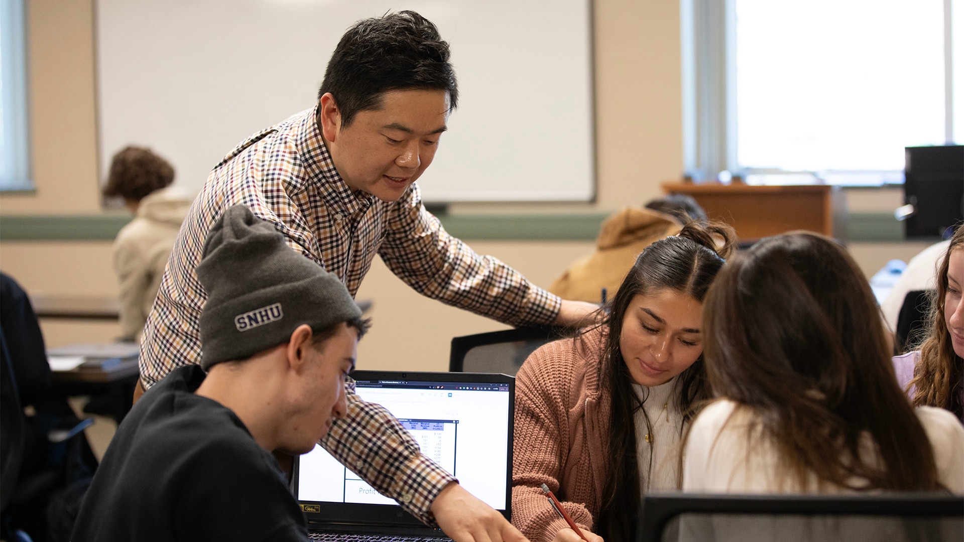 Group of students discussing and studying together.
