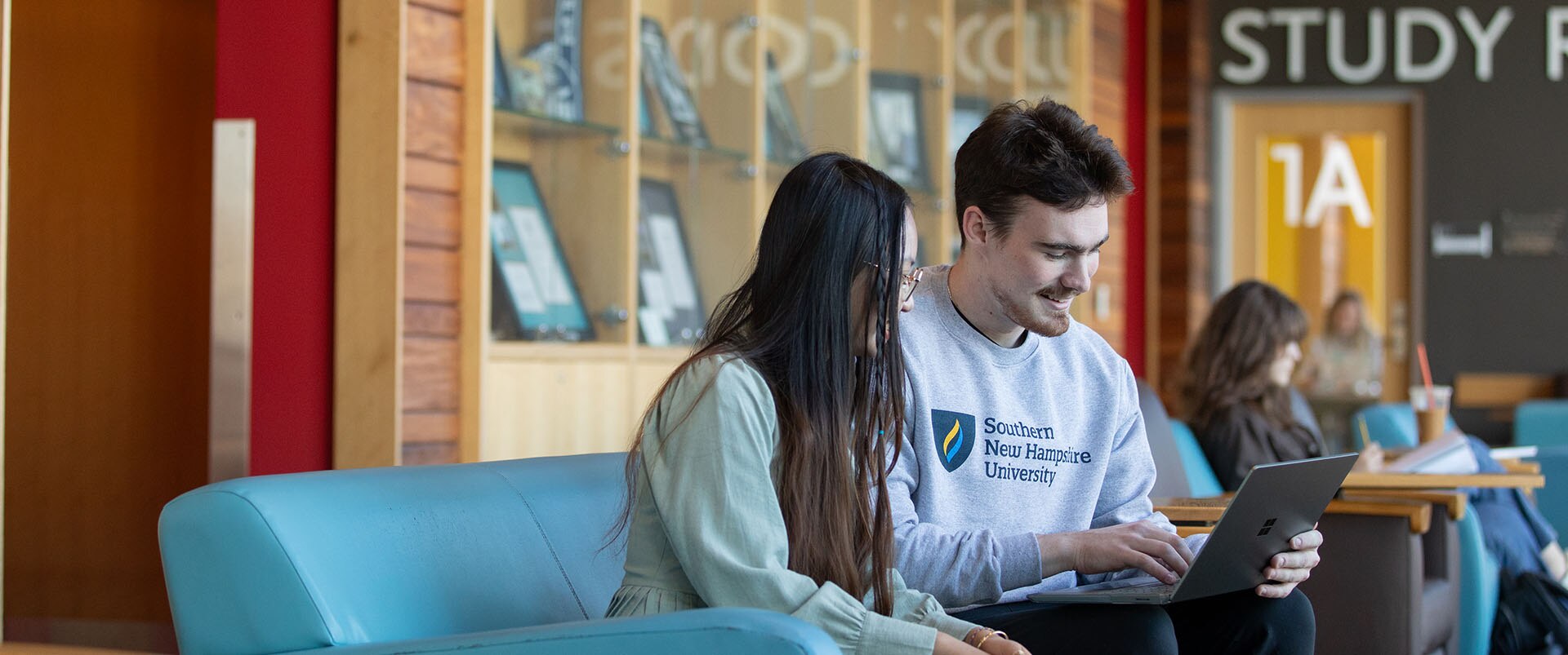 Students in a classroom working on thier assignments