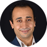 Faculty member Doruk Yunus smiling with black background